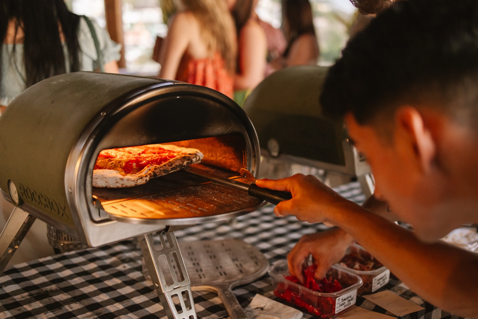 Sourdough pizza coming out of the Holy Crust portable oven