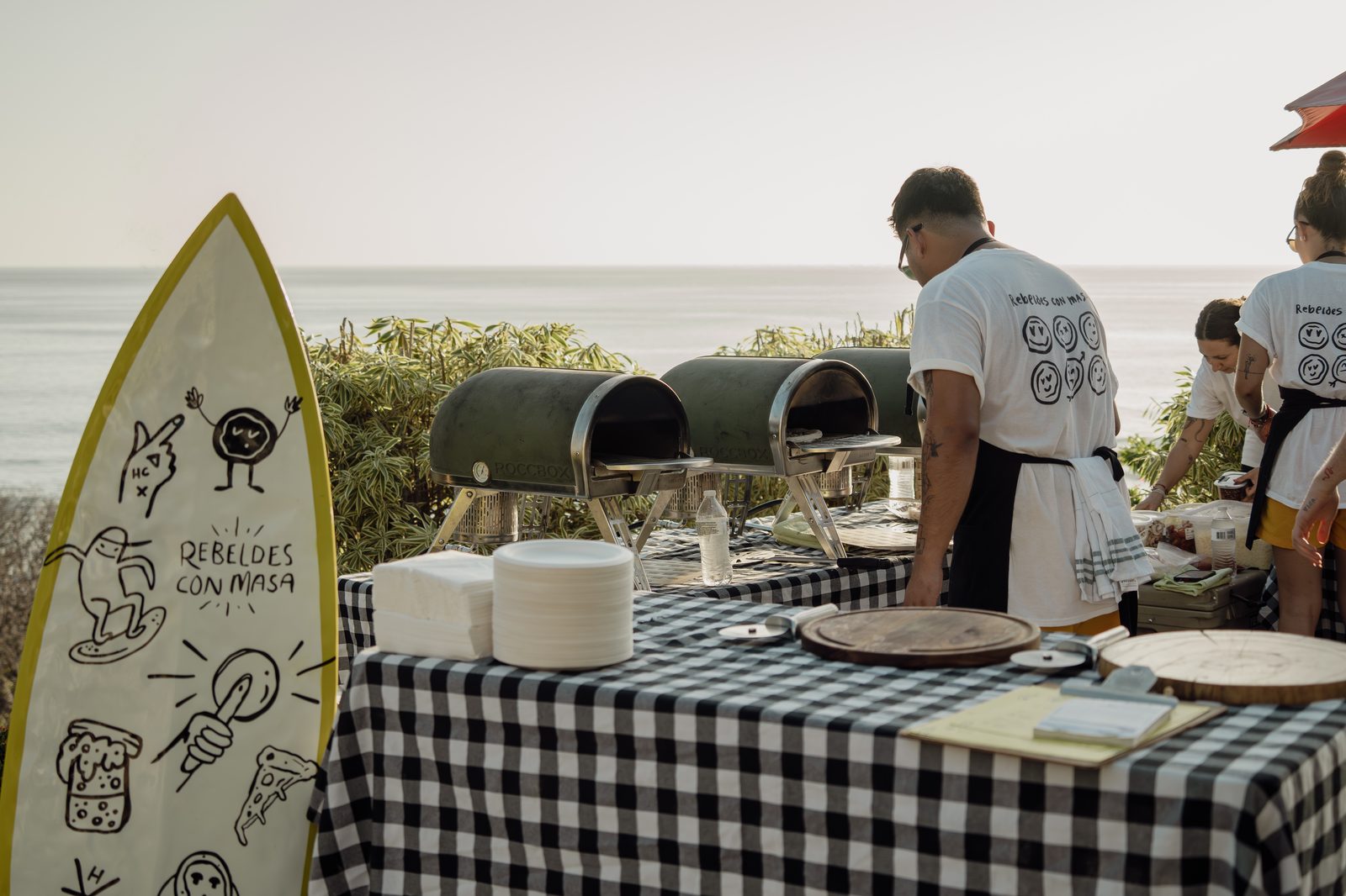 Holy Crust crew serving from the station at an outdoor event