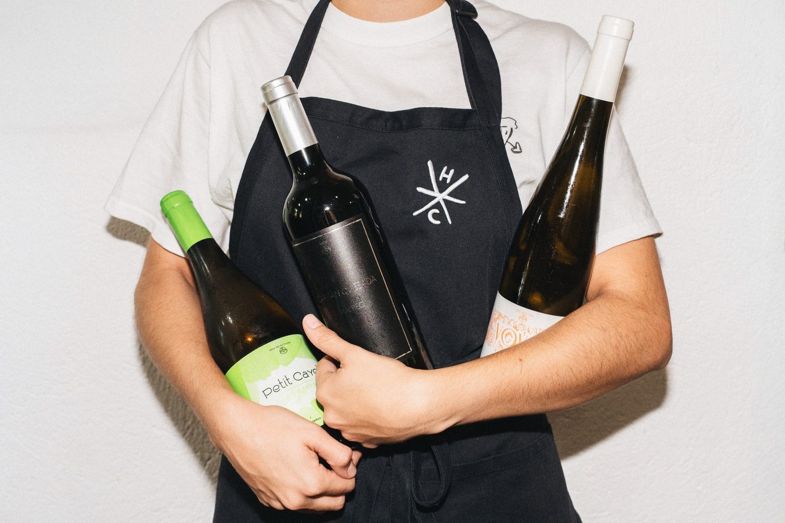 Holy Crust crew holding the wine selection for an RLT Cuisine event